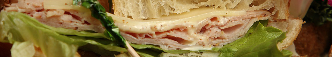 Eating Sandwich Bakery at Con Pane Rustic Breads & Cafe restaurant in San Diego, CA.
